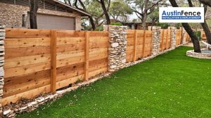 wooden fence with stone posts